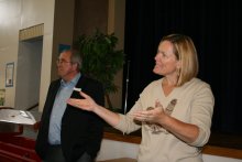 Local 111 member Diane Newton-Prior encourages classified employees at Sitton Elementary to stand during a presentation of a $5,000 AFL-CIO Adopt-A-School grant.